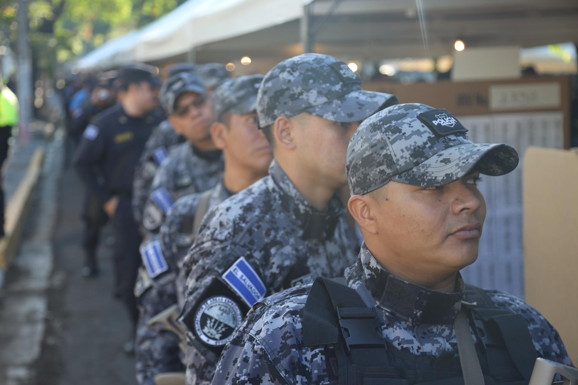 Police officers wait in line to vote in El Salvador's elections, Feb. 4, 2024.
