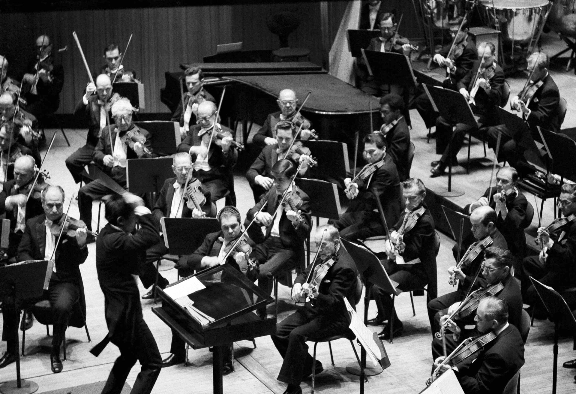 Seiji Ozawa of Japan, assistant conductor of the New York Philharmonic, leads the orchestra, March 29, 1965.