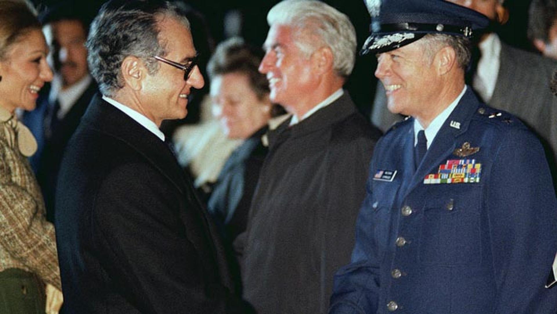 Mohammed Reza Pahlavi, Shah of Iran, shakes hands with a US Air Force general officer prior to his departure from the United States.