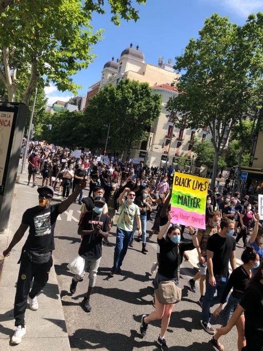 Protesters marched on June 7 in Madrid, Spain, holding signs with anti-racist slogans. 