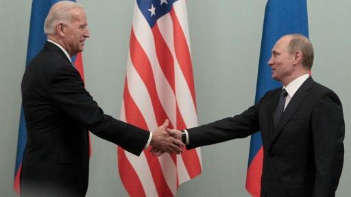 Then-Prime Minister Vladimir Putin shakes hands with Biden on the second day of his official visit to meet with top officials in the Russian capital in Moscow, March 10, 2011.
