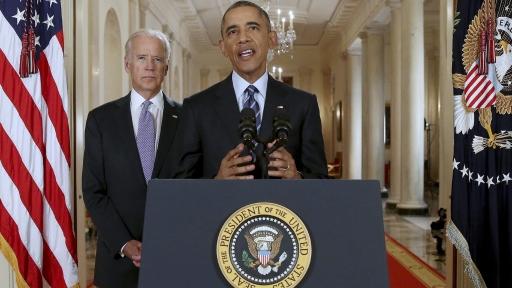 Former US President Barack Obama delivers a statement after a nuclear deal was reached between Iran and six major world powers, beside former Vice President Joe Biden, in the East Room of the White House in Washington, July 14, 2015.