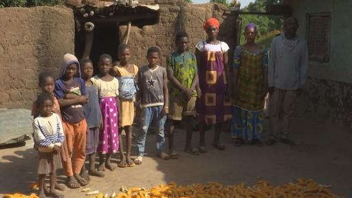 Farmer Issah Paate and his family pose for a photo in front of their home in Kpinchilla, a small village in northern Ghana. 