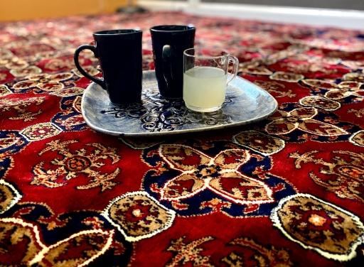 A newly arrived Afghan family, now in Sacramento, California, is slowly furnishing their apartment. A family friend, also from Afghanistan and now living in Sacramento, too, gave them a Persian rug. 