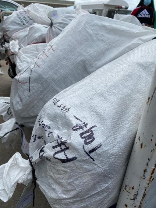 Stitched up bags are filled with belongings of migrants who have been deported back to Haiti. 