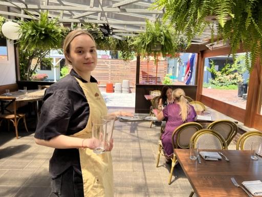 Vili Pendicheva, from Bulgaria, works two jobs bussing tables at two different restaurants in Newport, Rhode Island.