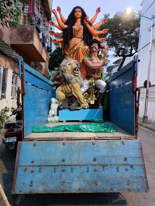 The goddess Durga riding on a truck en route to worship. 