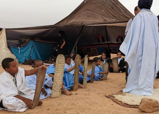 Sahrawi children in a refugee camp studying the Quran, Algeria