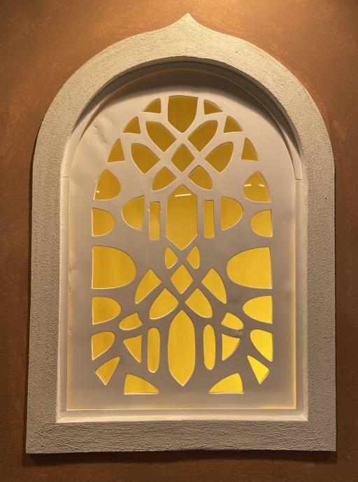 Intricately carved windows, known as qamaria, adorn the walls of the Bab al-Yemen restaurant, Boston, Apr. 12, 2023.