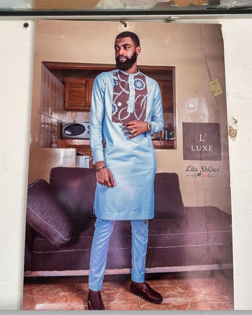 A poster of a man wearing a Senegalese kaftan hangs on the wall at the Mar Design tailor shop in central St. Louis, Senegal.
