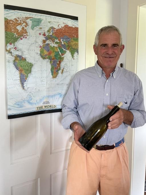 Pennel Ames holds one of the bottles which he threw into the Atlantic Ocean about two decades ago that was returned to him, Nantucket, Massachusetts, Jul. 30, 2023.