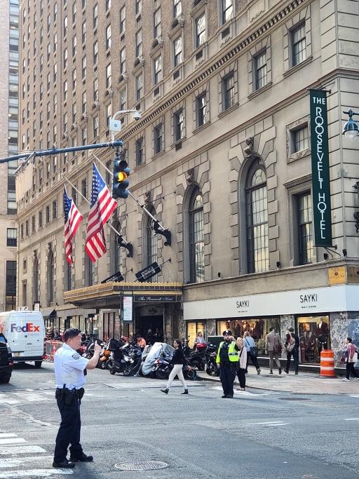 Law enforcement directs traffic around the Roosevelt Hotel. 