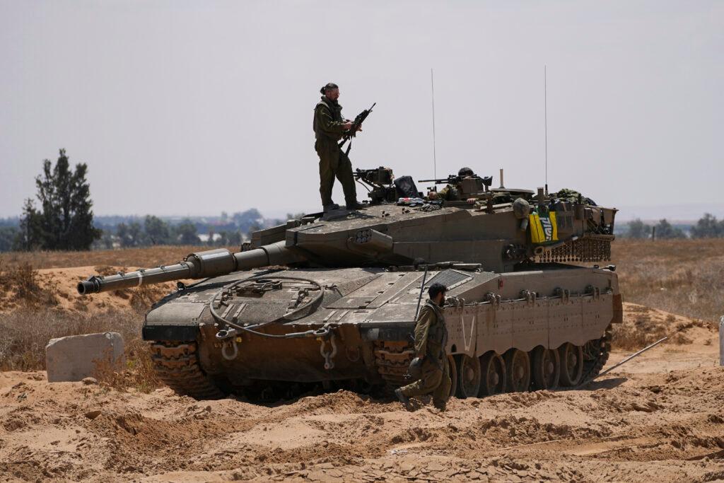 Israeli soldiers are seen near the border with the Gaza Strip, in southern Israel, Tuesday, May 7, 2024.