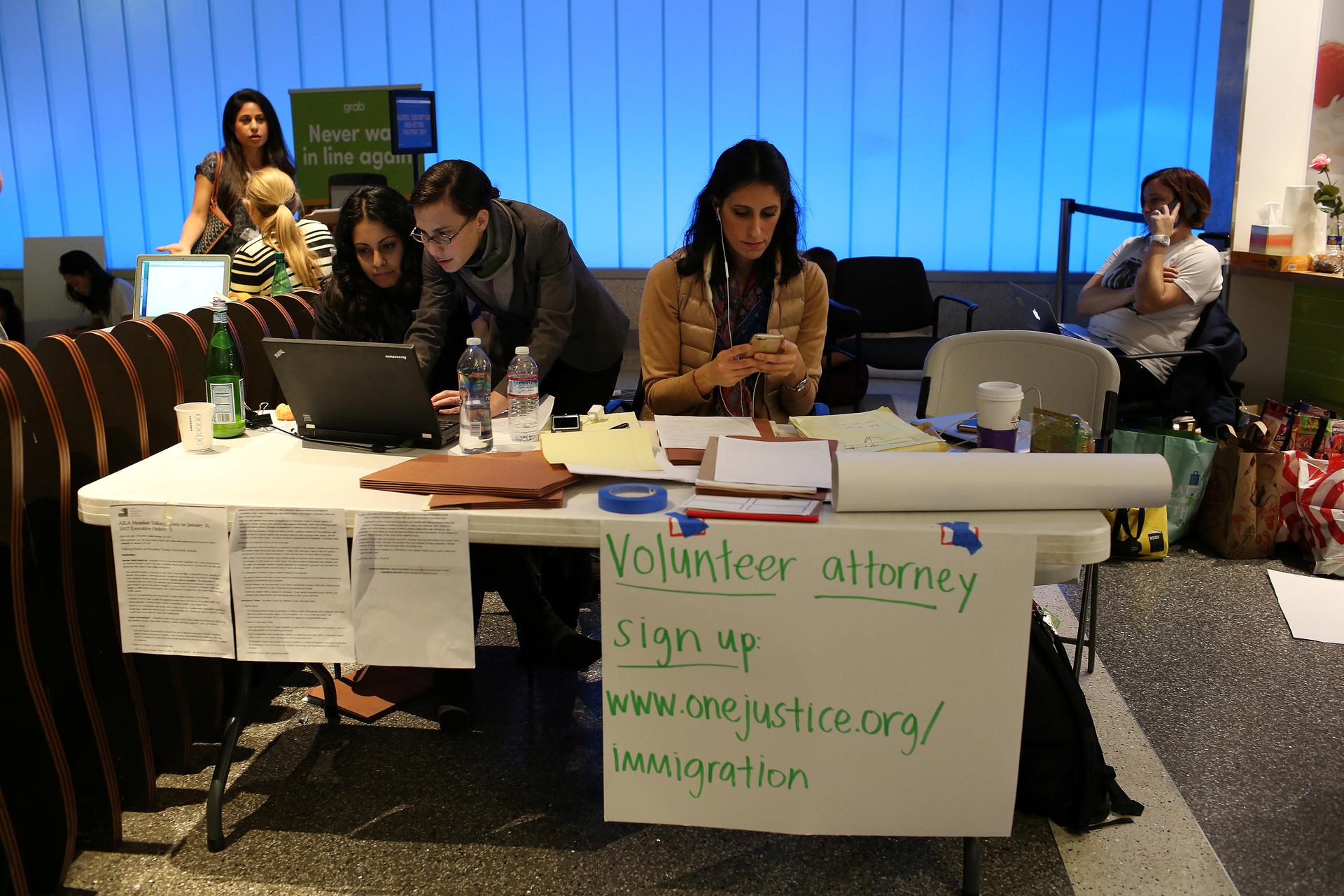 Volunteer immigration attorneys offer their services at Los Angeles International Airport, Jan. 31, 2017.