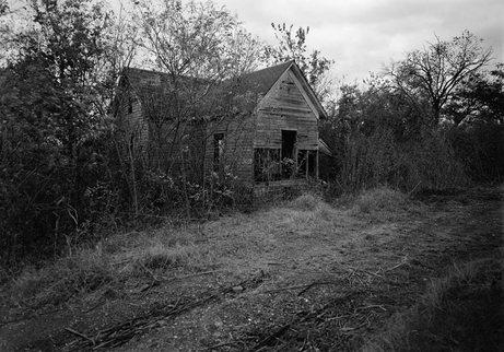 Woody Guthrie's Birthplace in Okfuskee County, Oklahoma in October 1979.  Guthrie was born into a middle-class family that fell on hard times during the Great Depression.