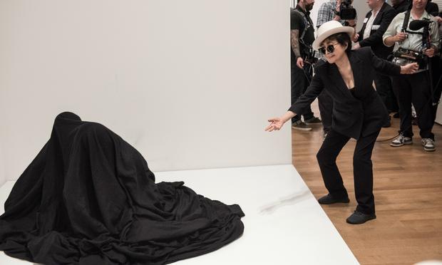 Yoko Ono with a participatory work at MoMA