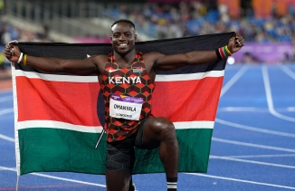 Kenya's Ferdinand Omanyala celebrates after winning gold in the men's 100m final during the athletics in the Alexander Stadium at the Commonwealth Games in Birmingham, England