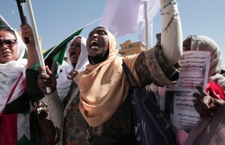 Sudanese demonstrators attend a rally to demand the return to civilian rule a year after a military coup, Khartoum, Sudan